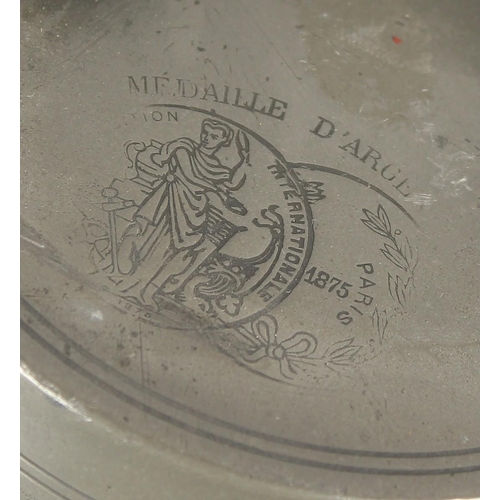 1298 - AN 18TH CENTURY FRENCH PEWTER BULBOUS CAN AND COVER with carrying handles. bears Paris scene. 7ins h... 