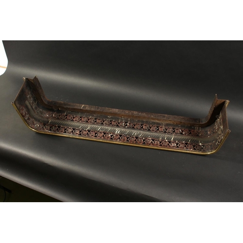 1315 - A 19TH CENTURY BRASS FENDER with pierced fretwork front on brass claw feet. 3ft 7ins long, 10ins dee... 