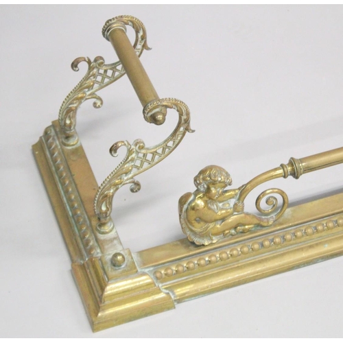 1319 - A GOOD 19TH CENTURY BRASS FENDER with cupid supports and pierced sides. 5ft long, 1ft 1ins deep.