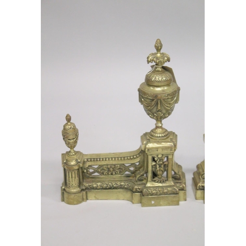 1328 - A GOOD PAIR OF 19TH CENTURY CAST BRASS CHENETS with urn finials. 1ft 3ins high, 11ins wide.