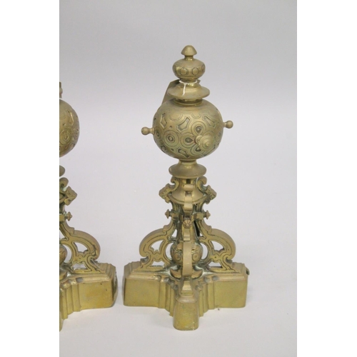 1329 - A GOOD PAIR OF 19TH CENTURY CAST BRASS CHENETS with three scrolling supports and base. 1ft 5ins high... 