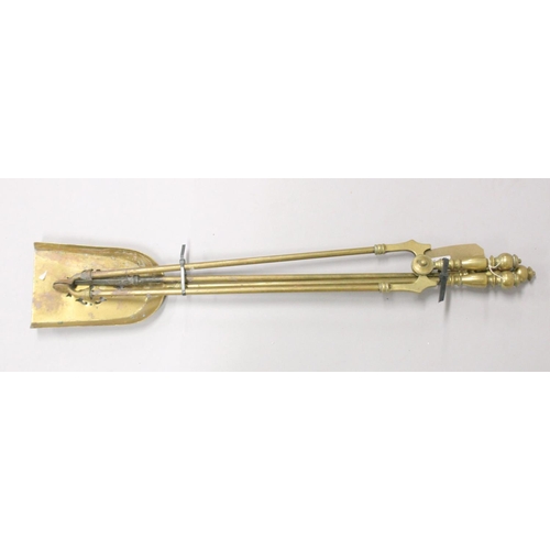 1334 - A SET OF THREE VICTORIAN BRASS FIRE IRONS.