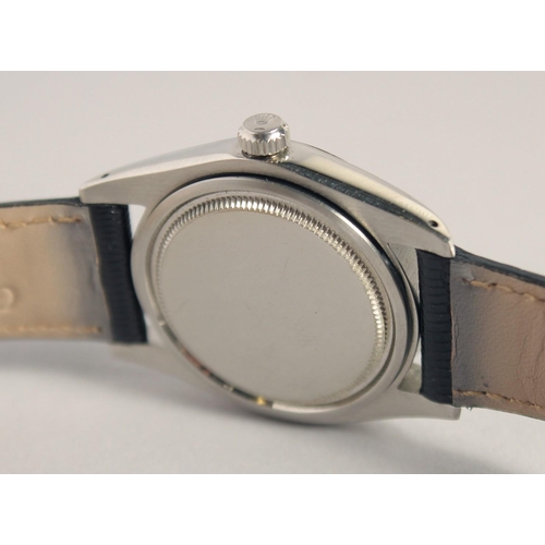 1344 - A GENTLEMAN'S ROLEX OYSTER DATE WRISTWATCH with black dial and leather strap.