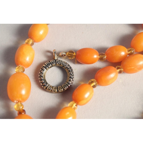 1358 - A BUTTERSCOTCH AMBER BEAD NECKLACE, twenty nine beads. Weight: 31gms, 20ins long.