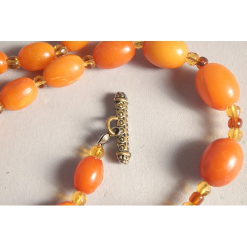 1358 - A BUTTERSCOTCH AMBER BEAD NECKLACE, twenty nine beads. Weight: 31gms, 20ins long.