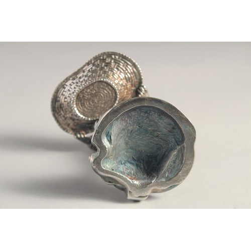 1370 - A PAIR OF SILVER PLATED YOUNG BOY AND GIRL SALTS both carrying baskets. 5.5ins high.