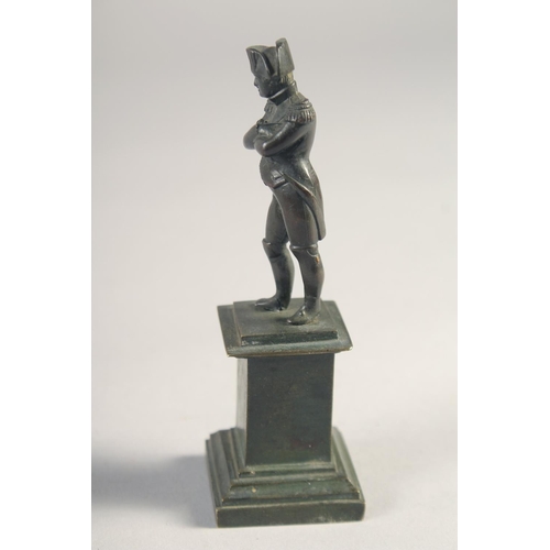 1382 - A SMALL BRONZE FIGURE OF NAPOLEON on a pedestal. 4.25ins high.