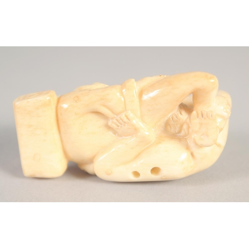 1396 - A SMALL CARVED BONE EROTIC NETSUKE. 2ins.