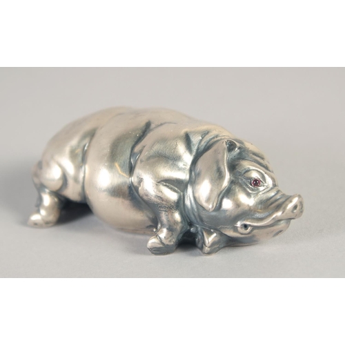 1401 - A RUSSIAN SILVER SLEEPING PIG. Marks: Head 84, Eagle. Faberge I. P. 2.75ins long, 43gms.