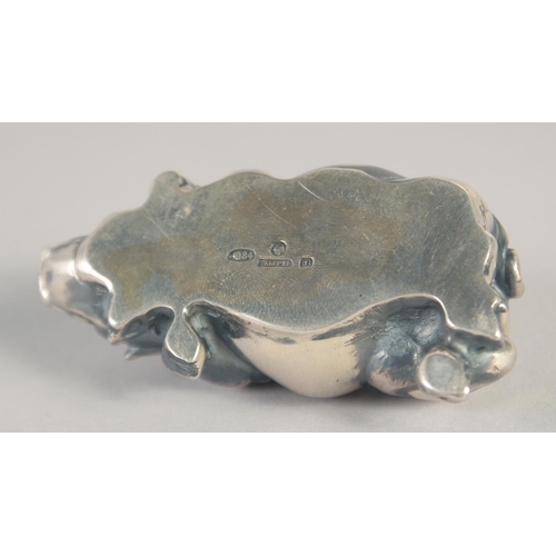 1401 - A RUSSIAN SILVER SLEEPING PIG. Marks: Head 84, Eagle. Faberge I. P. 2.75ins long, 43gms.