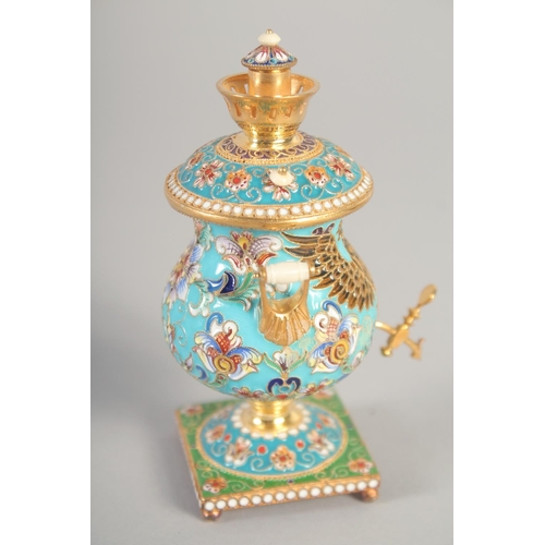 1412 - A SMALL RUSSIAN SILVER GILT AND ENAMEL SAMOVAR Mark: 84, 4ins high, 156gms.