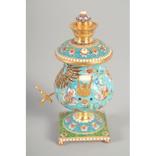 1412 - A SMALL RUSSIAN SILVER GILT AND ENAMEL SAMOVAR Mark: 84, 4ins high, 156gms.