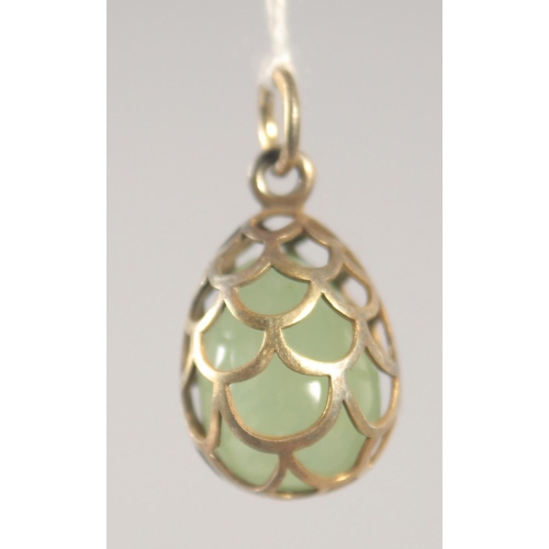 1414 - A SILVER PIERCED EGG PENDANT.