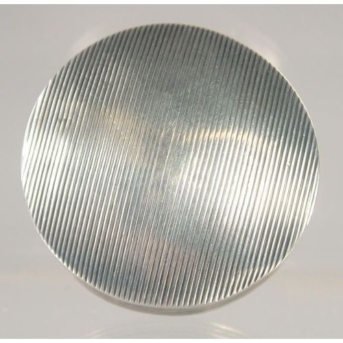 1418 - A SMALL DUTCH SILVER REEDED CIRCULAR SNUFF BOX. 1.75ins diameter.