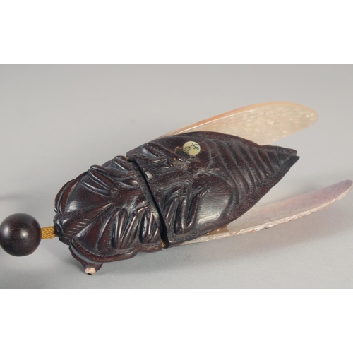 1419 - A JAPANESE CARVED WOOD AND MOTHER OF PEARL DRAGON FLY INRO. Signed with toggle. 4.5ins long.