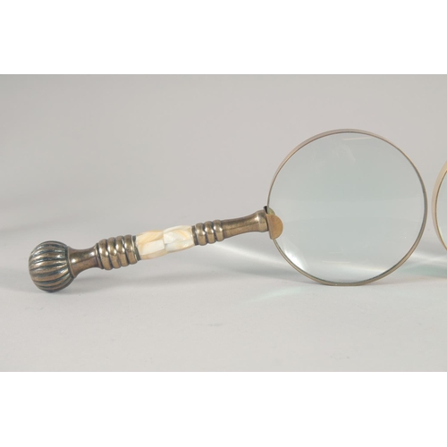 1429 - TWO MAGNIFYING GLASSES with mother of pearl handles.