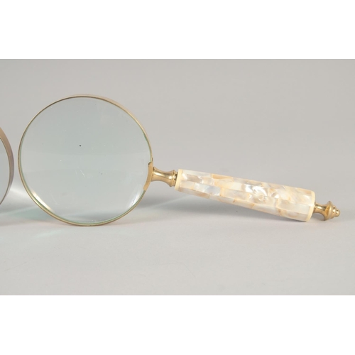 1429 - TWO MAGNIFYING GLASSES with mother of pearl handles.