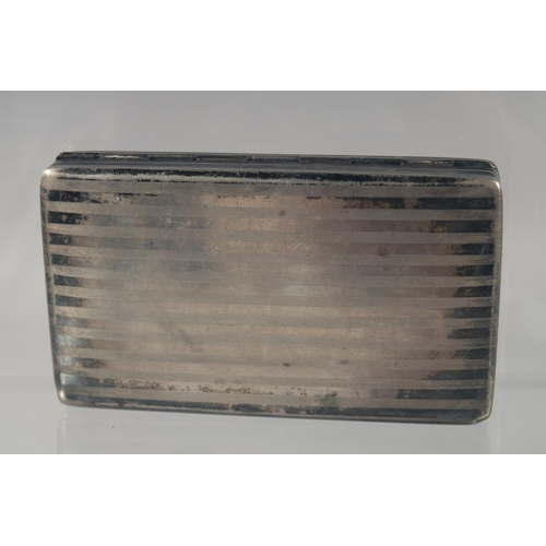 1444 - A DUTCH SILVER TOBACCO BOX, with engine turned decoration 13cm long.