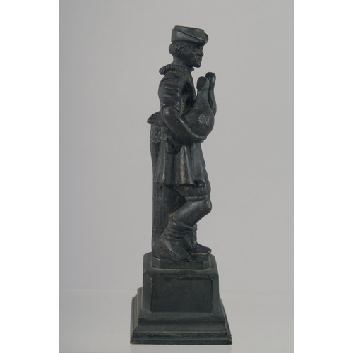 1448 - A SMALL CAST BRONZE FIGURE OF A MAN STANDING ON A PLINTH, with a goose in each arm. 15cm high.