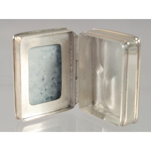 1451 - A SMALL MODERN SILVER PILL BOX, with enamel decoration of a girl seated on a bench. 3cm c 2.5cm.