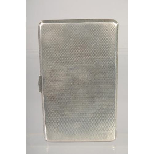 1468 - A GOOD LARGE HEAVY ENGINE TURNED CIGARETTE CASE with and oval enamel of a glamour girl. 5.5ins x 3in... 