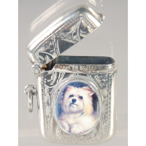 1475 - AN EDWARD VII SILVER VESTA CASE with an oval enamel of a Scottie dog. 1.5ins x.75ins Birmingham 1907... 