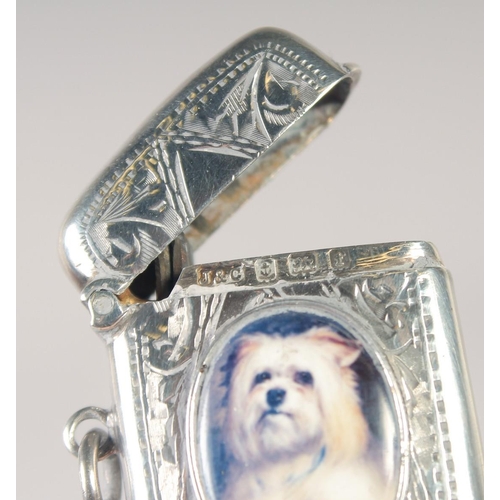 1475 - AN EDWARD VII SILVER VESTA CASE with an oval enamel of a Scottie dog. 1.5ins x.75ins Birmingham 1907... 