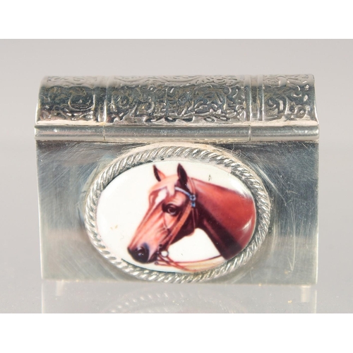 1479 - A SMALL SILVER BOOK SHAPED COMPACT with an enamel of a horse. 1.75ins x 1in.