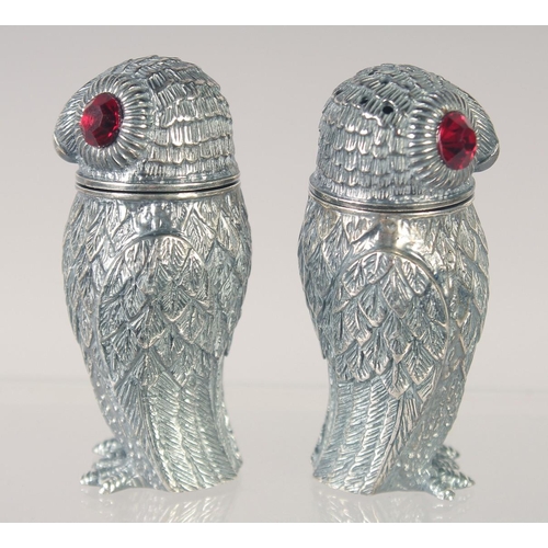 1490 - A PAIR OF 800 OWL SALT AND PEPPERS. 2.5ins high.