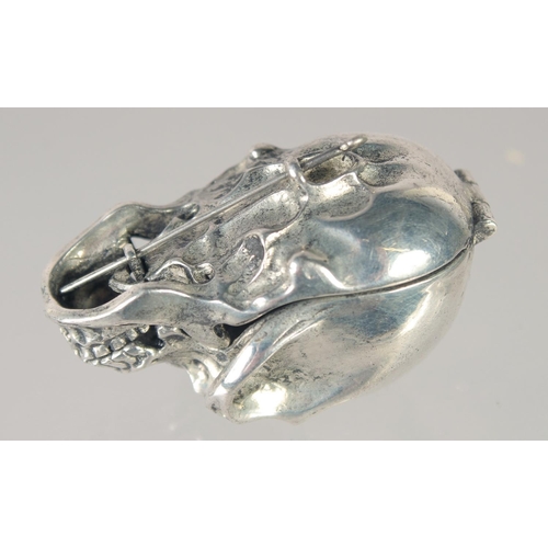 1501 - A SILVER PLATED SKULL SNUFF BOX. 1.75ins