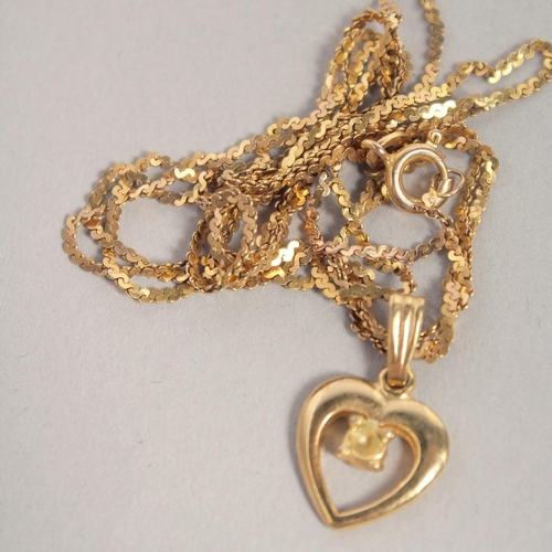 1535 - A 9CT GOLD CROSS AND CHAIN, SCALES OF JUSTICE PENDANT AND CHAIN AND HEART PENDANT AND CHAIN. 15gms.... 