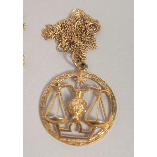 1535 - A 9CT GOLD CROSS AND CHAIN, SCALES OF JUSTICE PENDANT AND CHAIN AND HEART PENDANT AND CHAIN. 15gms.... 