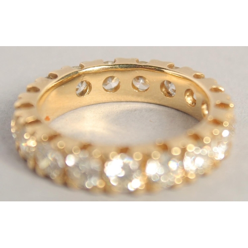 1542 - A SUPERB 18CT YELLOW GOLD DIAMOND ETERNITY RING set with 4ct diamonds of twenty stones, in an Asprey... 