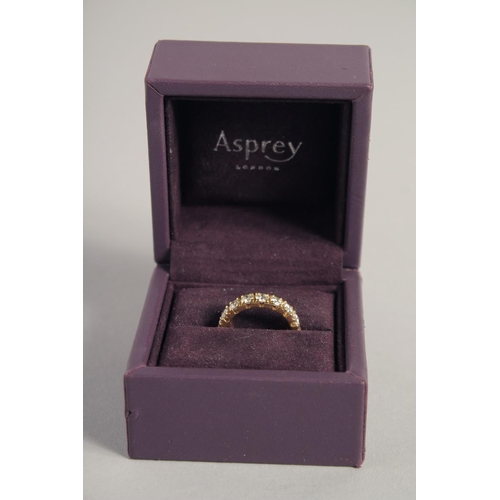 1542 - A SUPERB 18CT YELLOW GOLD DIAMOND ETERNITY RING set with 4ct diamonds of twenty stones, in an Asprey... 