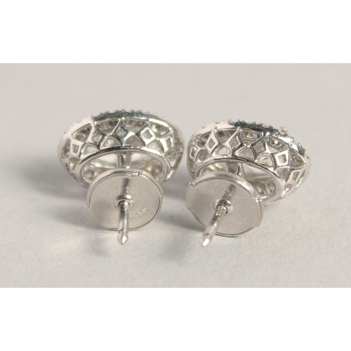 1546 - A SUPERB PAIR OF 18CT WHITE GOLD OVAL DIAMOND SET EARRINGS, the central diamonds 1.03ct to 1.02ct.