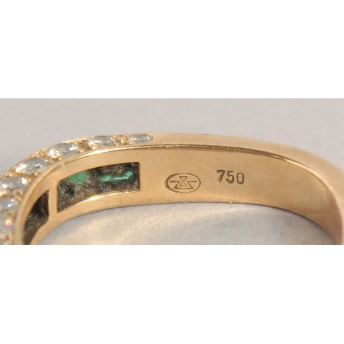 1552 - AN 18CT GOLD EMERALD AND DIAMOND THREE ROW RING.