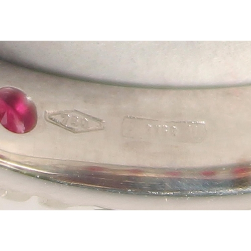 1556 - AN 18CT WHITE GOLD RUBY AND DIAMOND FULL ETERNITY RING.