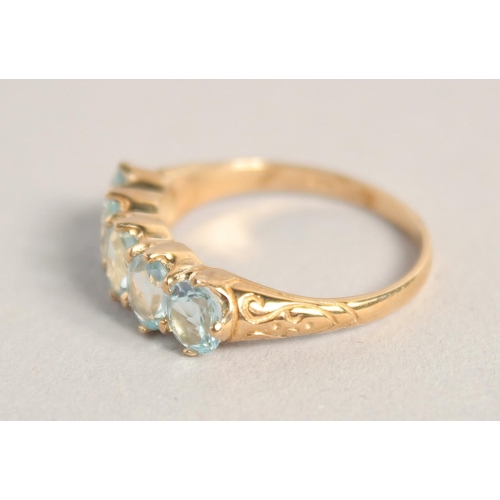 1557 - A 9CT GOLD FIVE STONE AQUAMARINE RING.