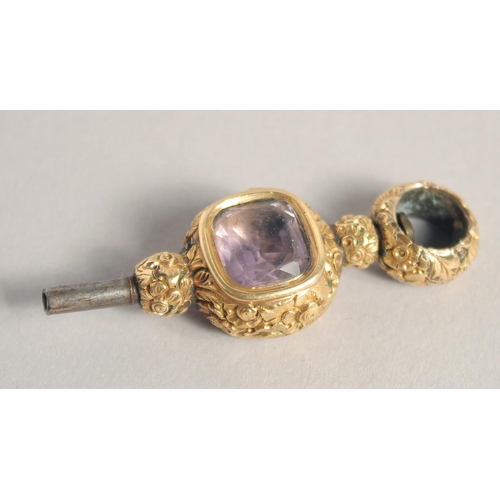 1558 - AN AMETHYST AND BLOODSTONE SET CLOCK KEY.