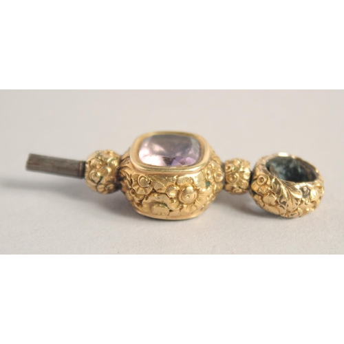 1558 - AN AMETHYST AND BLOODSTONE SET CLOCK KEY.