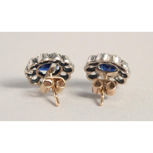 1560 - A SUPERB PAIR OF EDWARDIAN NATURAL SAPPHIRE AND DIAMOND SET OVAL CLUSTER EARRINGS.