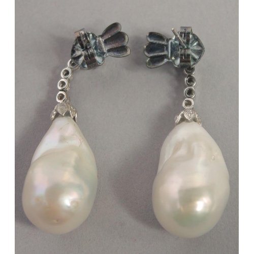 1563 - A PAIR OF 18CT WHITE GOLD LARGE DROP PEARL AND DIAMOND EARRINGS with gemological certificate.