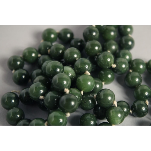 1571 - A GOOD LONG JADE BEAD NECKLACE. 32ins long.