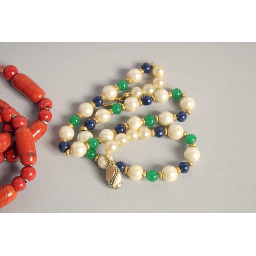 1573 - A TWO-COLOUR AGATE NECKLACE, THREE-COLOUR PEARL NECKLACE and an ORANGE STONE NECKLACE (3).