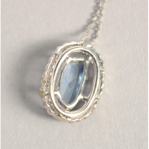 1581 - AN 18CT WHITE GOLD AQUAMARINE DIAMOND OVAL PENDANT on a chain,