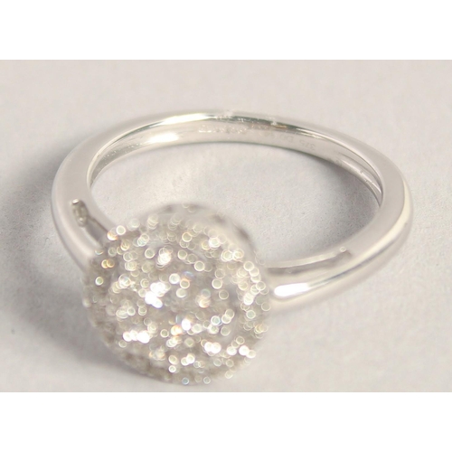 1591 - A GOOD 9CT GOLD DIAMOND CIRCULAR RING.