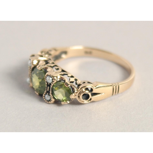 1592 - A GOOD 9CT GOLD PERIDOT AND PEARL RING.