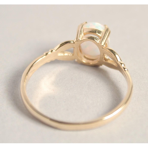 1598 - A 9CT GOLD OPAL RING.