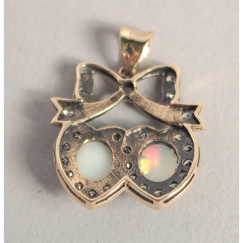 1602 - A 9CT GOLD, OPAL, AND DIAMOND SWEETHEART PENDANT.