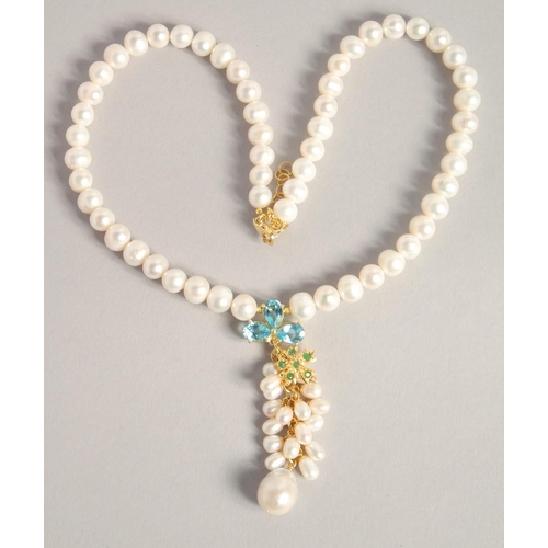 1607 - A PEARL NECKLACE with blue topaz and emerald necklace.